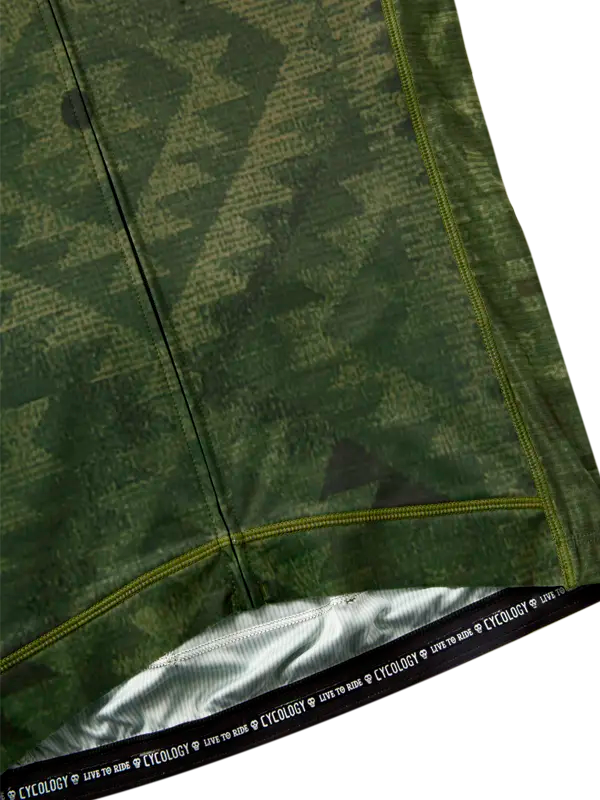 Green camouflage-patterned fabric with a brand label at the bottom.
