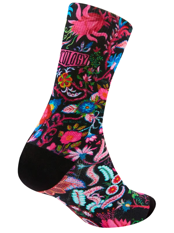 Floral cycling sock rear view with Cycology branding