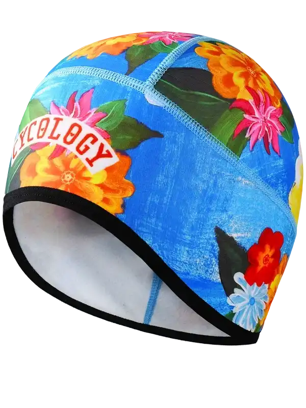 Colorful floral cycling cap with 'CYCOLOGY' logo, blue background, vibrant flowers, black trim