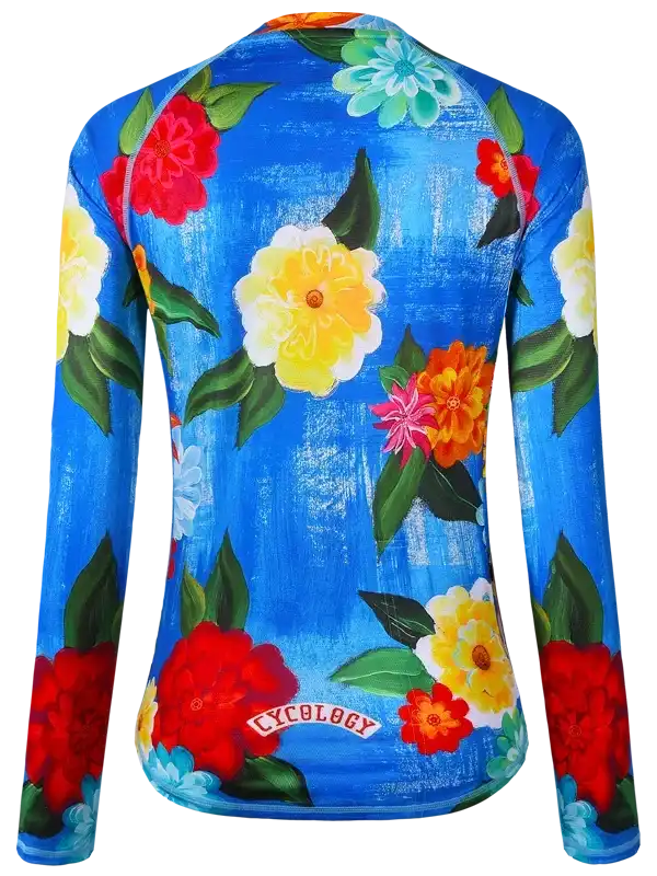 Women's long sleeve cycling jersey with vibrant floral print on blue background, featuring Cycology logo