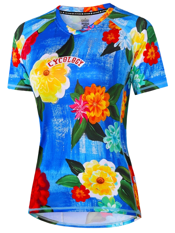 Women's colorful floral MTB jersey with 'Cycology' branding on a blue background