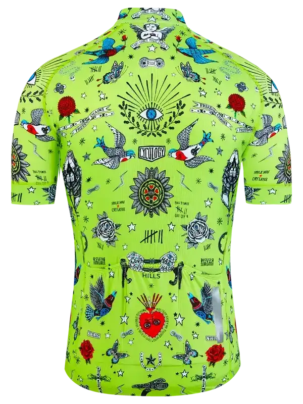 Vibrant green men's cycling jersey with tattoo-style birds, roses, and eye motifs for road biking
