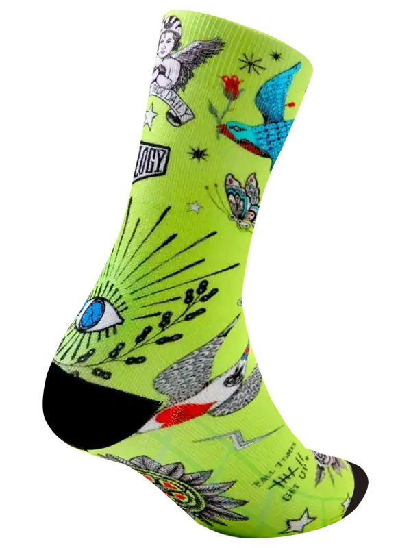 Neon green cycling sock with tattoo-style graphics, birds, eye, and stars for men's and women's bike rides