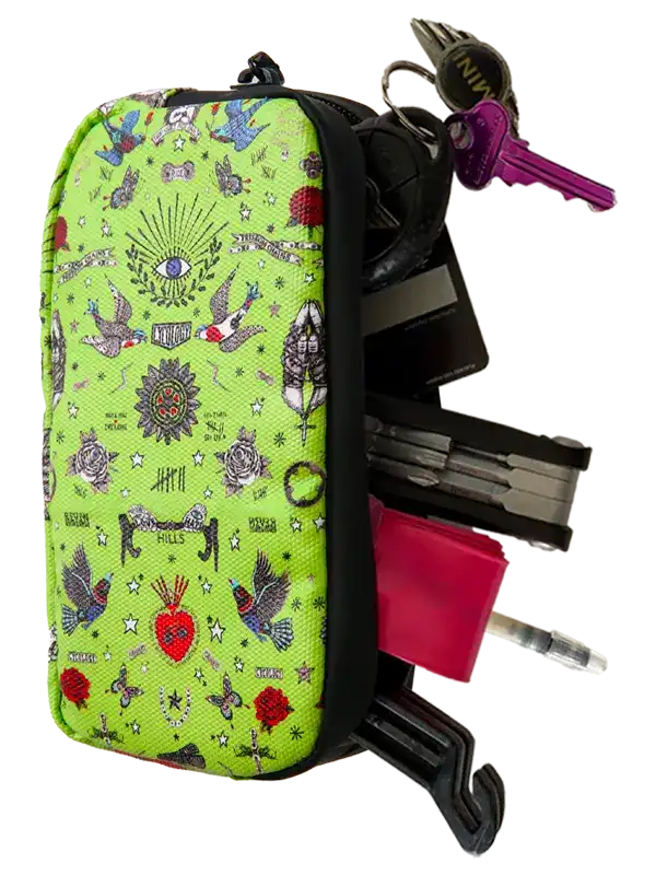 Cycology Clothing Tattoo Cycling Wallet in lime green with various tools and keys.