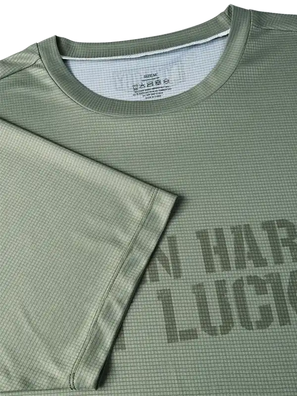 Olive green cycling jersey with textured fabric and bold graphic print, ideal for men's and women's bike rides
