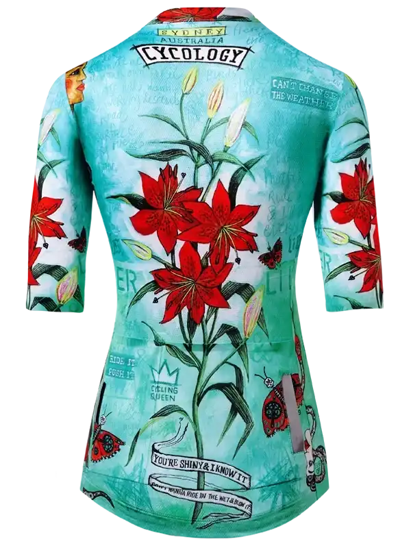 Women's cycling jersey with red lilies, butterflies, and floral print on teal background
