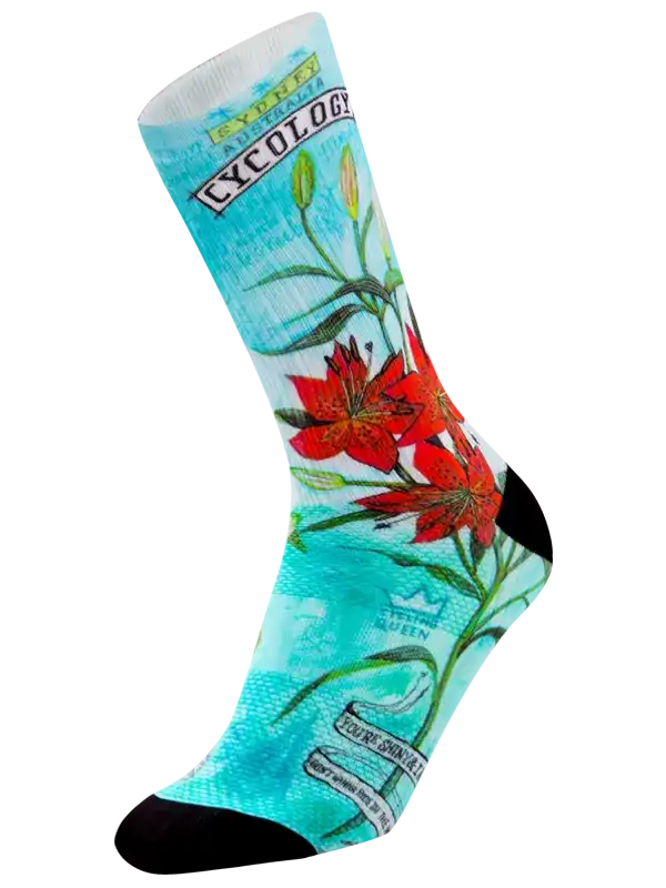 Cycling sock with red lily floral print, turquoise background, and 'Cycology' branding for road bike riders
