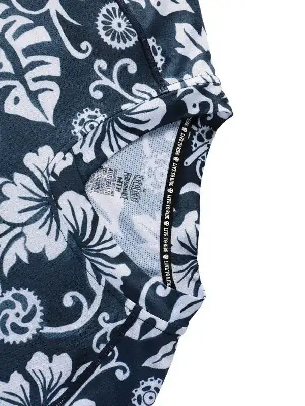 Black and white floral cycling jersey with gear accents, breathable mesh lining, and performance fabric details