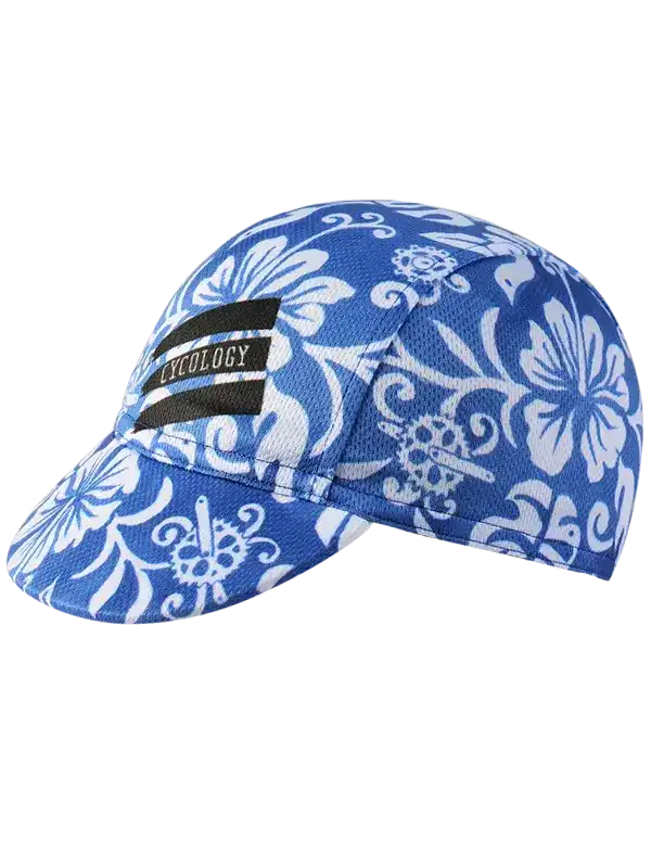 Blue floral cycling cap with white hibiscus pattern and black logo patch