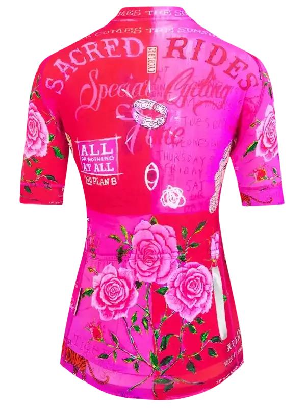 Pink cycling jersey with floral rose design and bold text for women's bike rides