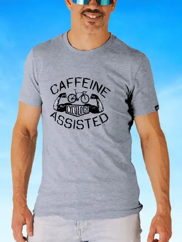 Gray cycling t-shirt with 'Caffeine Assisted' graphic, featuring a bike and flexing arms design.