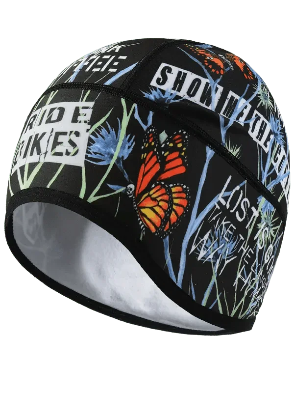 Cycling skull cap with butterfly and wildflower print, bold text design for bike riders