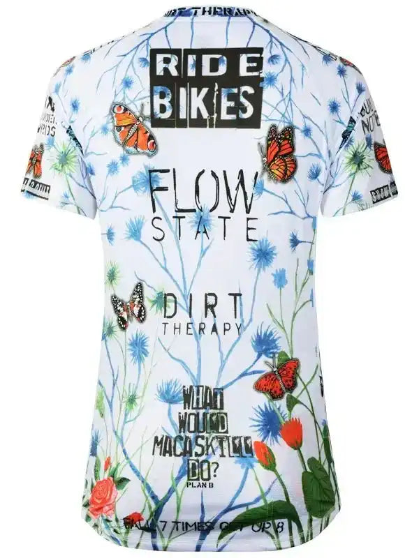 White women's cycling jersey with butterfly and floral print, 'Ride Bikes' and 'Flow State' text
