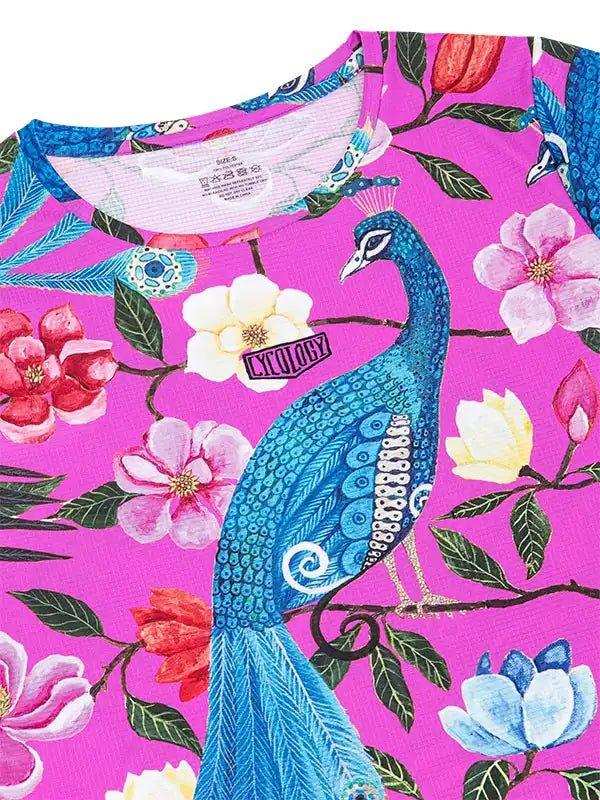 Vibrant pink cycling jersey with blue peacock and floral print, featuring unique design details.