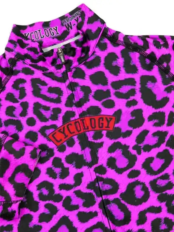 Vibrant pink leopard print women's cycling jersey with bold Cycology logo and full zipper