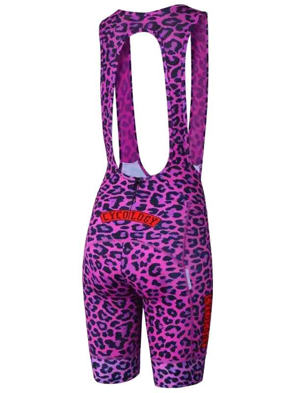 Pink leopard print women's cycling bib shorts with bold branding, designed for comfort and style on rides.