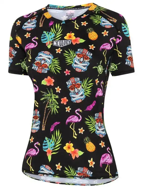 Women's tropical cycling jersey with flamingos, pineapples, and tiki masks on black fabric