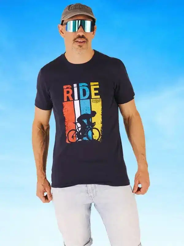 Man wearing cycling t-shirt with 'RIDE' graphic and cyclist design, ideal for bike enthusiasts and outdoor rides.