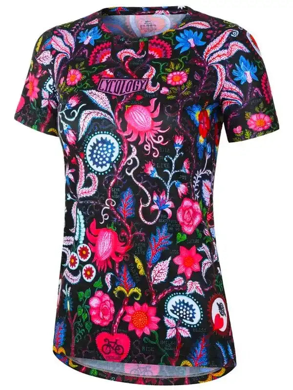 Women's cycling jersey with vibrant floral and paisley print on black, featuring bike motifs and bold colors