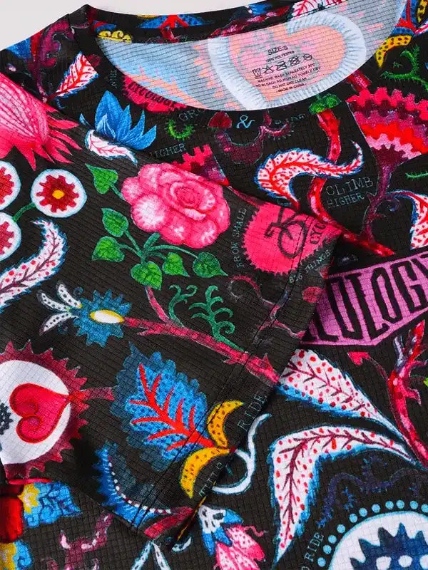 Vibrant floral and bike graphic cycling jersey with bold colors and unique design for men and women