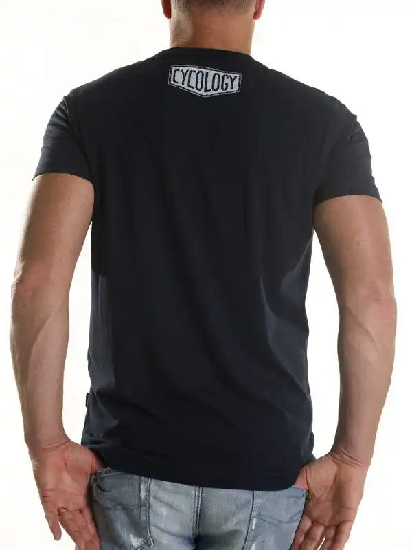 Men's black cycling t-shirt with Cycology logo on back, casual fit for active lifestyle