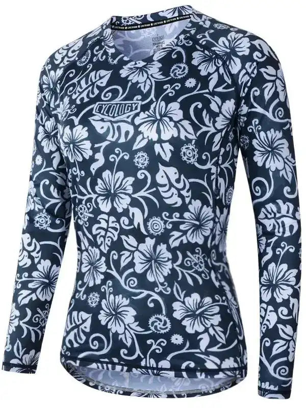Women's long sleeve cycling jersey with white floral print on navy blue, featuring breathable fabric and ergonomic fit