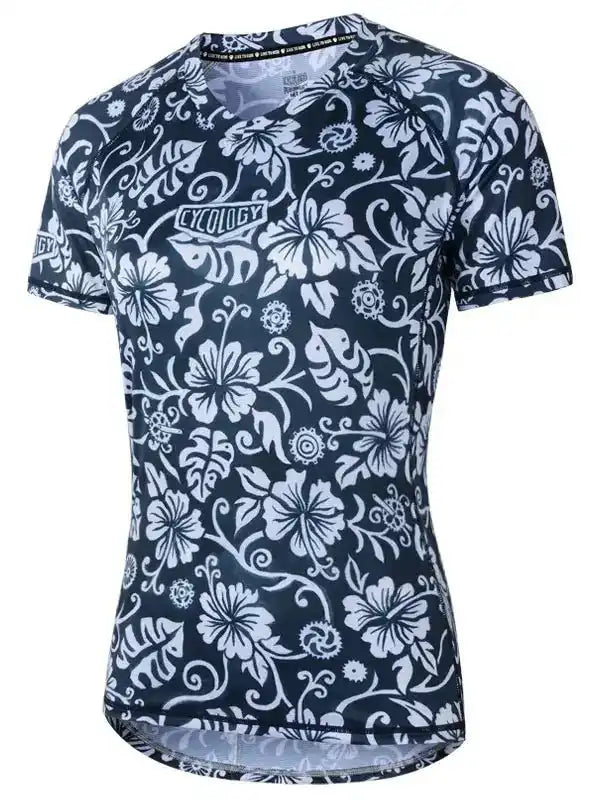 Women's navy cycling jersey with white floral print, breathable fabric, and ergonomic fit for road biking