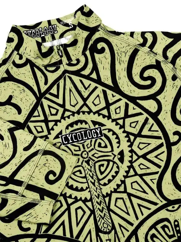 Men's cycling jersey with bold black tribal print on light green, featuring zipper and brand logo