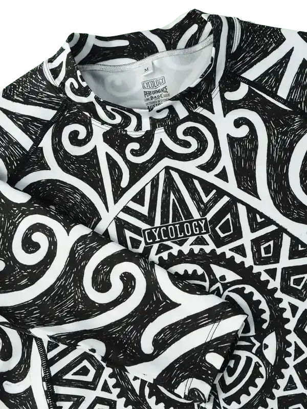 Black and white cycling jersey with bold geometric and swirl patterns, featuring 'CYCOLOGY' logo