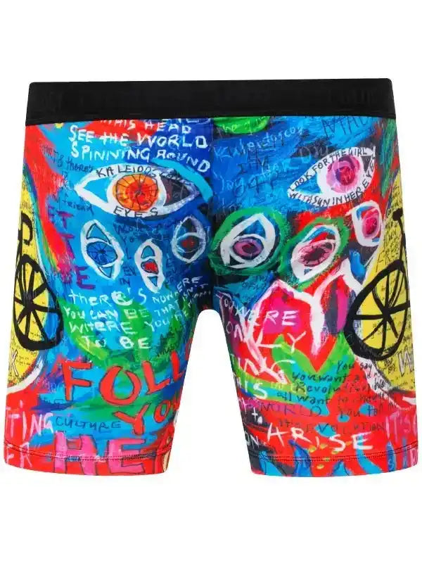 Colorful graffiti-style cycling shorts with bold eyes, text, and bike wheels design