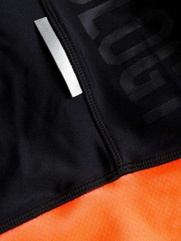 Black and orange cycling jersey with reflective stripe and bold graphic design