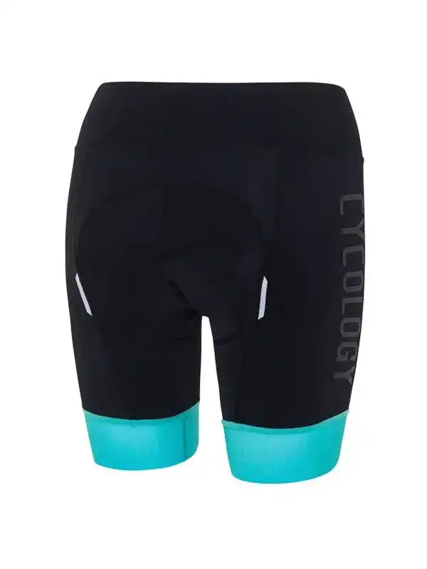 Black women's cycling shorts with turquoise hem and reflective accents, featuring padded seat for comfort.