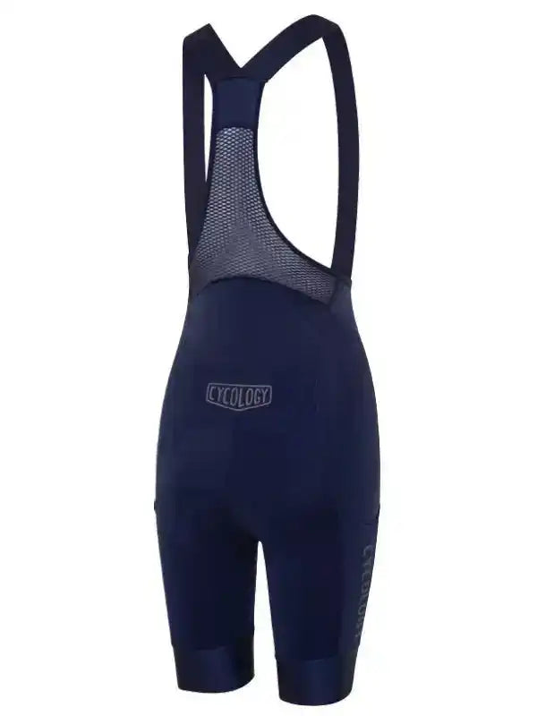 Navy blue cycling bib shorts with mesh back panel and Cycology branding, designed for comfort and performance.
