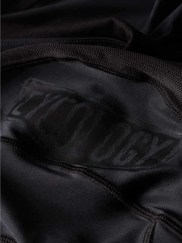 Black cycling jersey with subtle brand logo, high-quality fabric design for performance