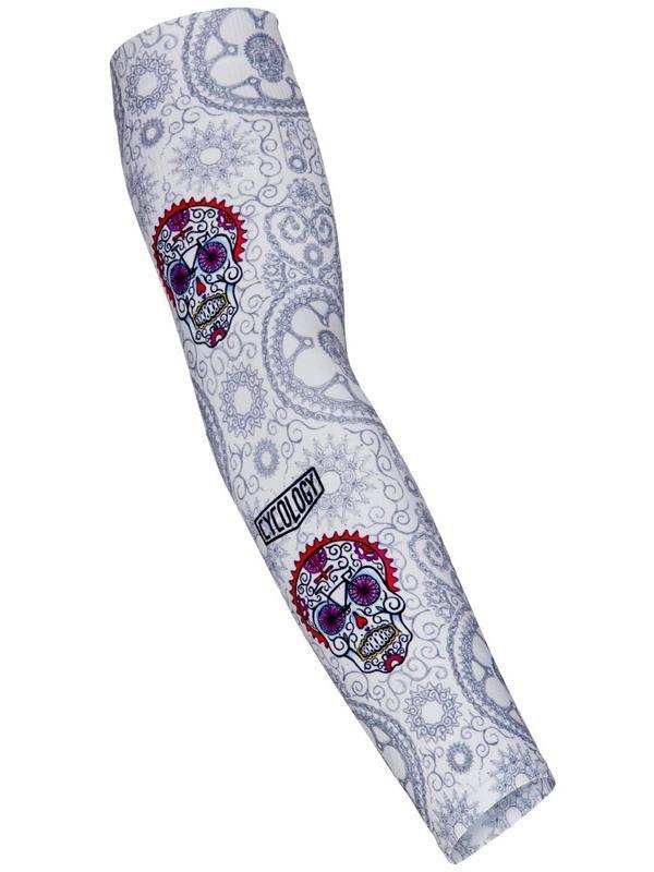 Cycling arm sleeve with sugar skull print, paisley pattern, and brand logo for bike rides