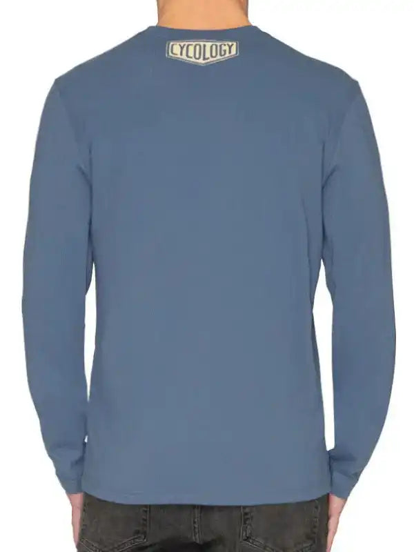 Men's blue long sleeve cycling shirt with Cycology logo on back, ideal for casual or ride wear.