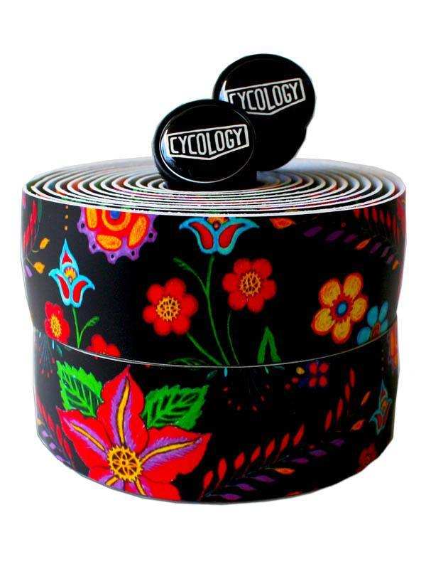 Vibrant floral cycling handlebar tape with bold colors and black background, featuring branded end plugs.