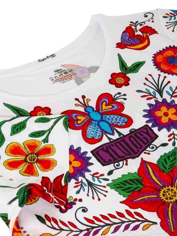 White cycling jersey with colorful floral and butterfly embroidery, vibrant design for men and women