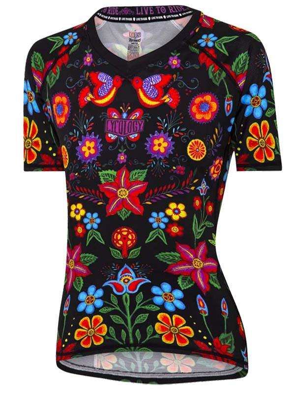 Vibrant floral cycling jersey with colorful birds and flowers on black fabric for women's rides