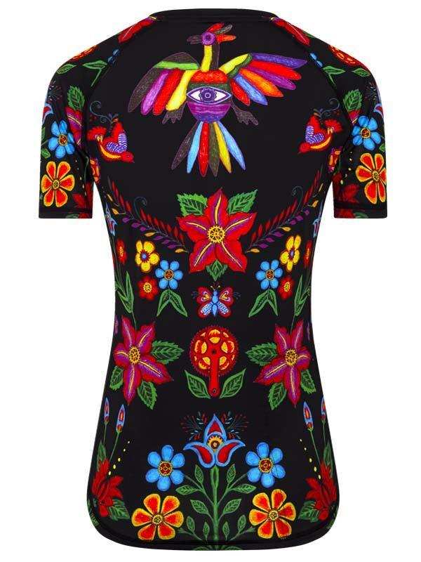 Women's cycling jersey with vibrant floral and bird print on black background, colorful short sleeve design