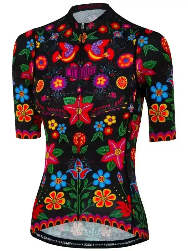 Women's cycling jersey with vibrant floral and bird print on black, featuring short sleeves and full zip.
