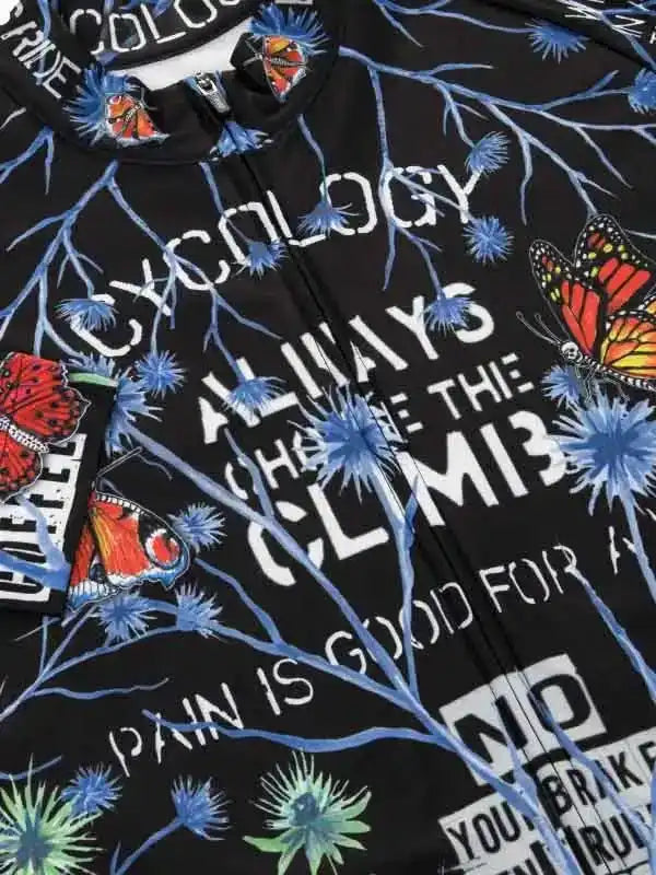 Black cycling jersey with butterfly and floral print, motivational text 'Always Chase the Climb'