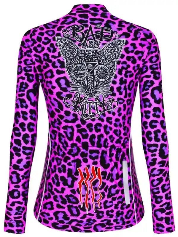 Women's cycling jersey with pink leopard print, 'Bad Ass Kitty' graphic, and reflective details for road biking.