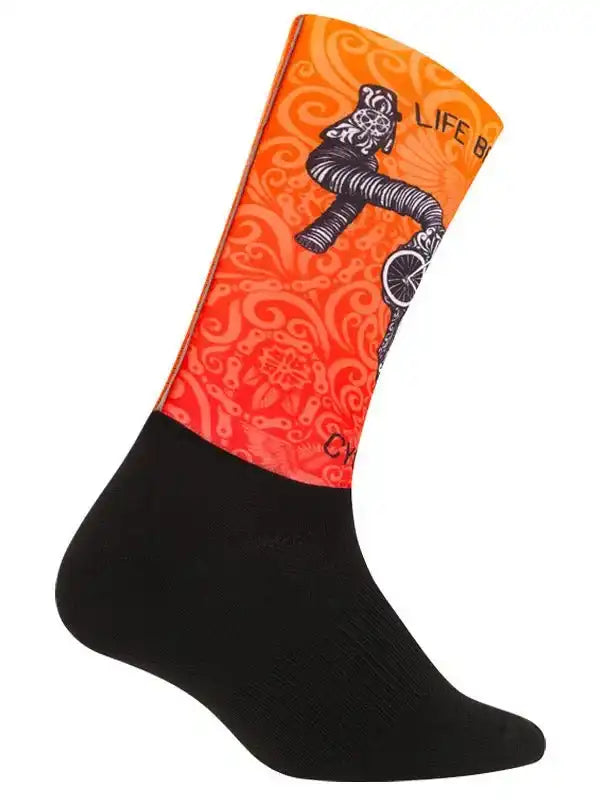 Orange cycling sock with black skeleton biker graphic, swirl pattern, and 'Life' text for men's or women's bike rides