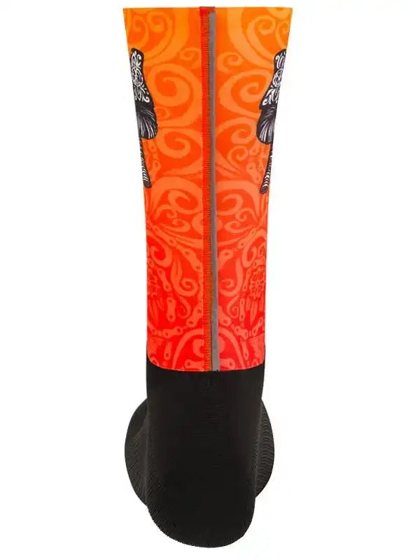 Orange and black cycling sock with swirl pattern and reflective stripe for men's and women's bike rides