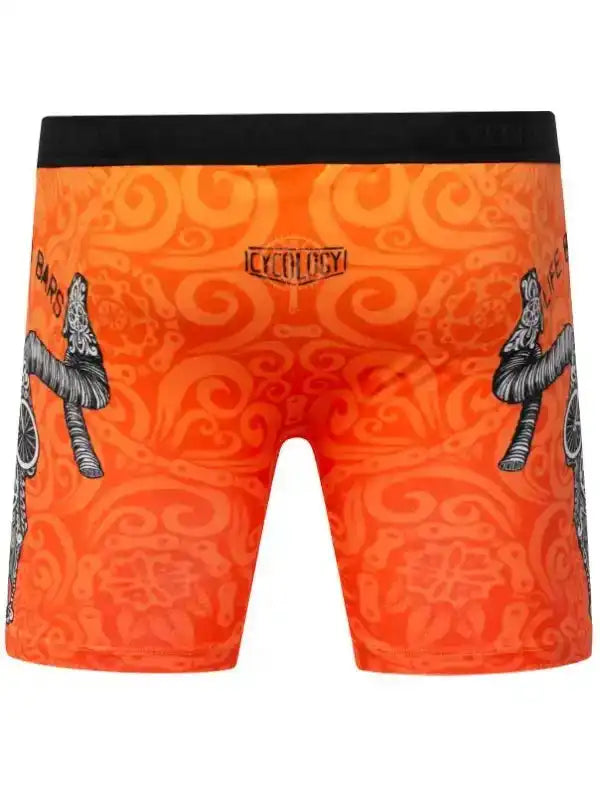 Orange cycling shorts with black waistband and bike graphic print, featuring unique swirl pattern design