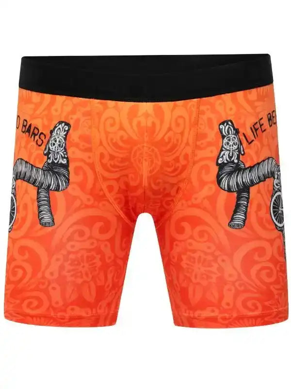 Orange cycling shorts with bike handlebar print and black waistband, men's bike apparel