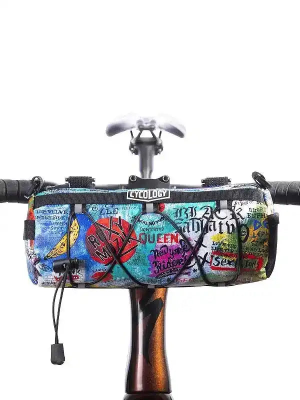 Colorful graffiti-style cycling handlebar bag with bold graphics, perfect for road bike adventures and urban rides.