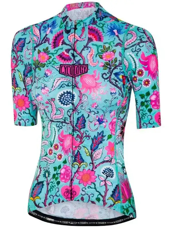 Women's cycling jersey with vibrant floral and paisley print on teal background, featuring full zip and brand logo.