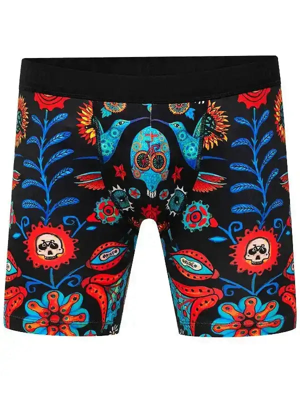 Men's cycling boxer briefs with vibrant sugar skull and floral print, featuring bike motifs and bold colors.